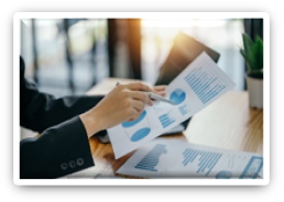 Close-up of business woman hands check company finances and earnings and budget with graph on desk in the office. (Provided by Getty Images)
